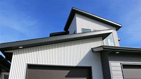 white corrugated metal house|homes with metal siding photos.